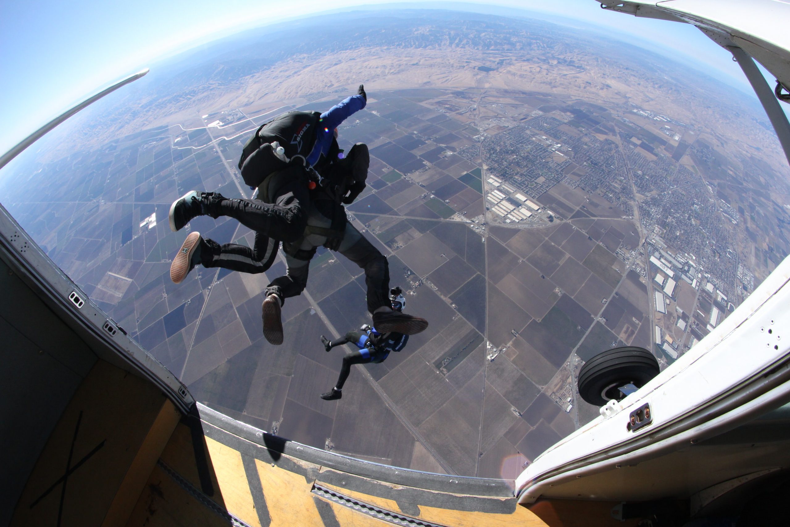 A photographer captures a tandem pair exiting the Grand Caravan