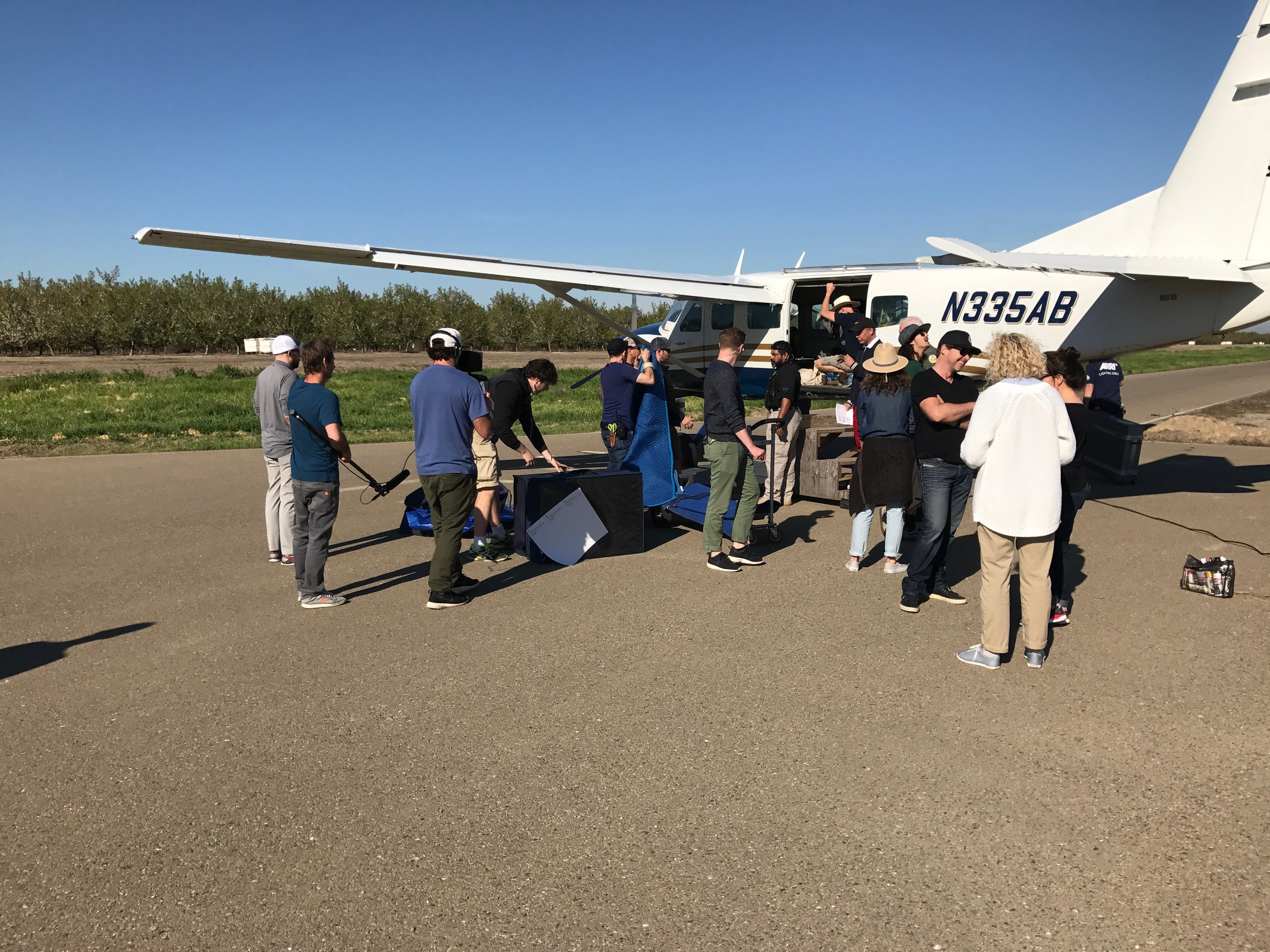 Film production crew setting up on the runway at Skydive California, highlighting the site as a versatile Northern California film location.