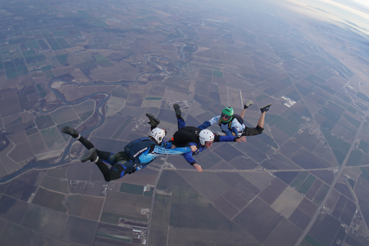 AFF student in free fall with two instructors.