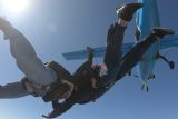 Two experienced jumpers in free fall at Skydive California.