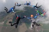 Experienced licensed skydivers in 7-way formation at Skydive California.