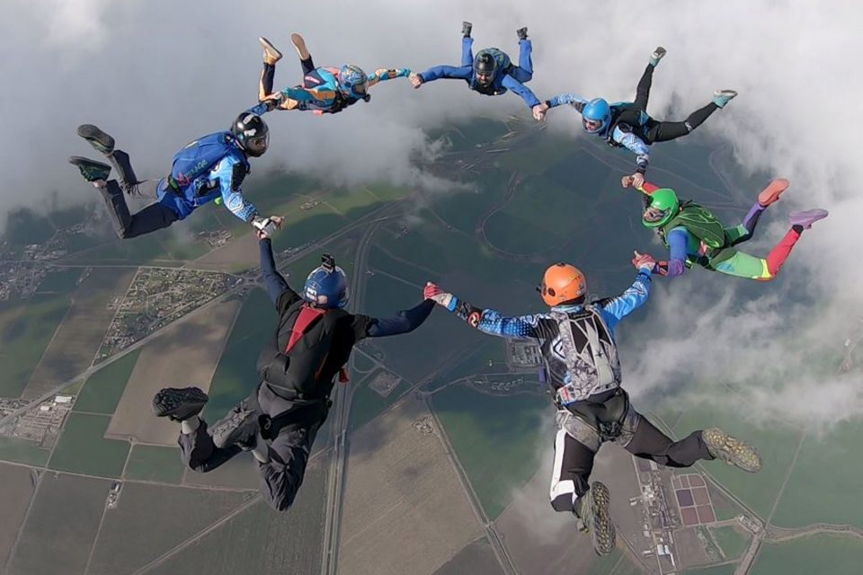 Experienced skydivers in 7-way formation at Skydive California.