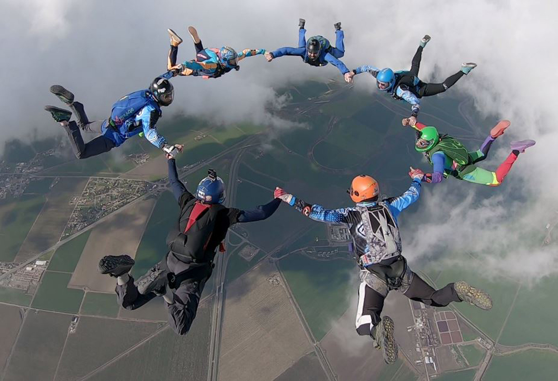 Experienced skydivers in 7-way formation at Skydive California.