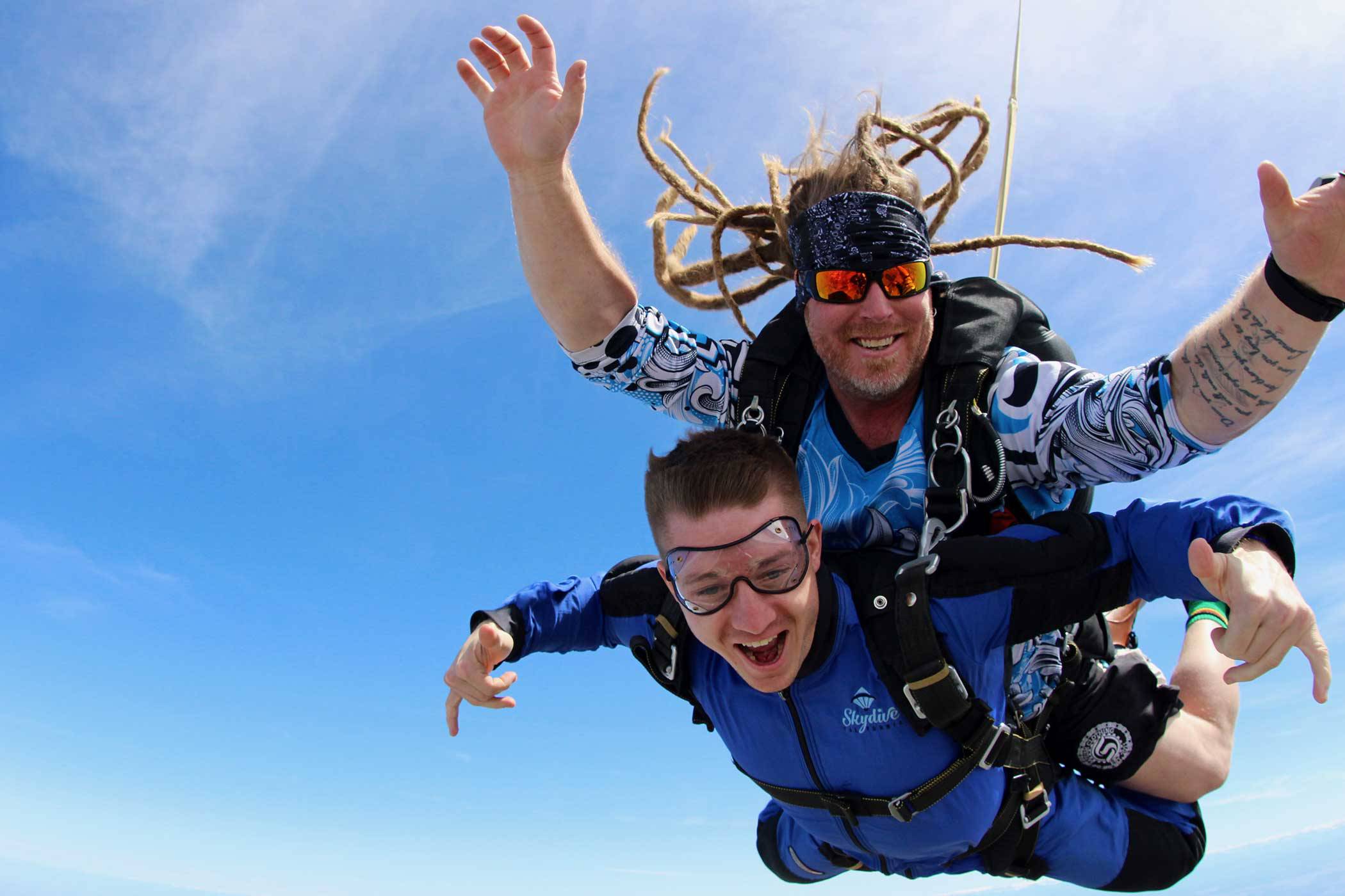 Man is excited to be enjoying his skydive at Skydive California