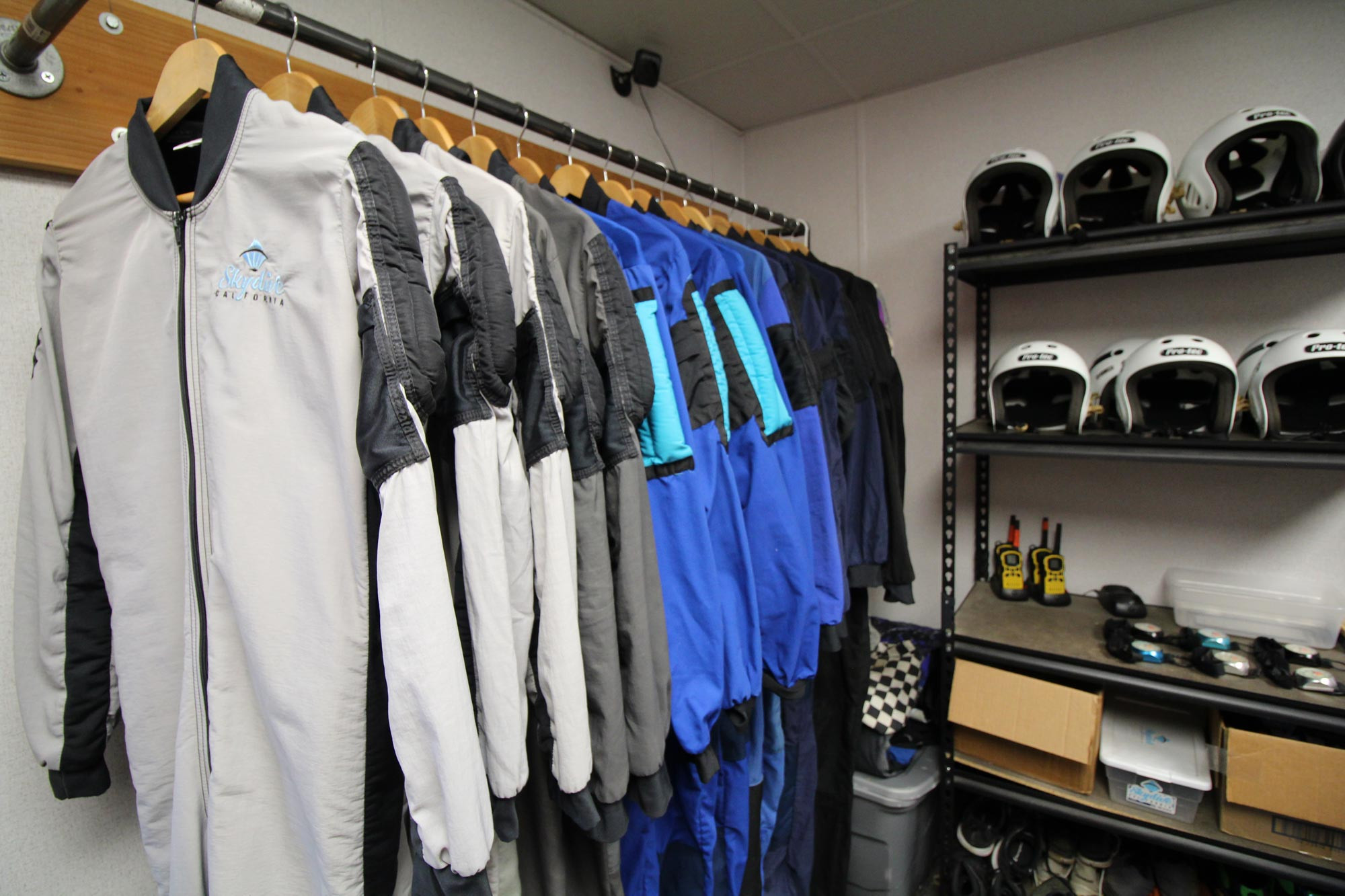 Skydive California jumping gear including suits and helmets.